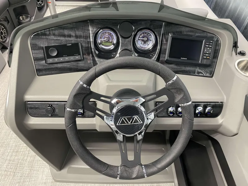 Slide: The Image of 2025 Avalon LSZ 2385 VRB Tritoon dashboard with steering wheel and control panel. - 9