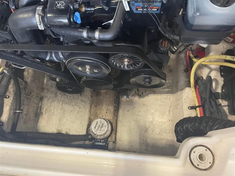 Slide: The Image of Engine compartment of a 2003 Chaparral 260 SSi boat, showing belts and components. - 17