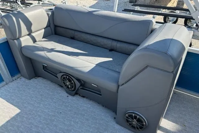 Slide: The Image of 2020 Tahoe Pontoon GT Quad Lounger 23' with gray seating and built-in speakers. - 10