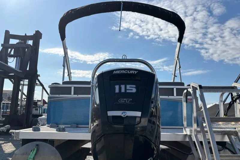 Slide: The Image of 2020 Tahoe Pontoon GT Quad Lounger 23' with Mercury 115 engine, docked under blue sky. - 12