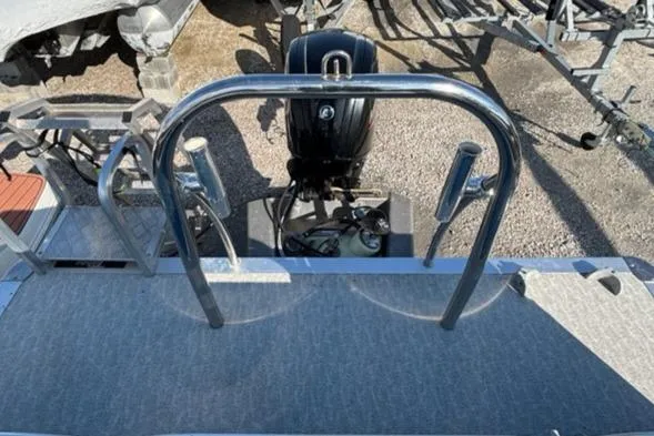 Slide: The Image of 2020 Tahoe Pontoon GT Quad Lounger 23' with motor and rear deck view. - 7