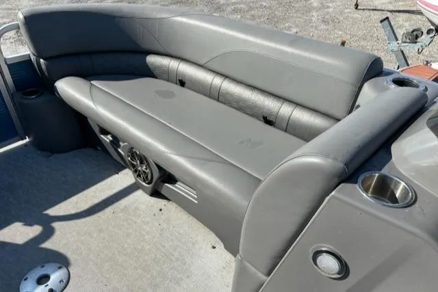Slide: The Image of 2020 Tahoe Pontoon GT Quad Lounger 23' with gray seating and cup holders. - 8