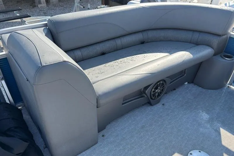 Slide: The Image of 2020 Tahoe Pontoon GT Quad Lounger 23' with gray seating and built-in speaker. - 9