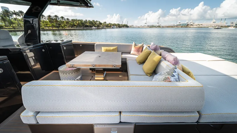 Slide: The Image of Luxurious 2023 Pardo Yachts P50 with elegant outdoor seating and scenic waterfront view. - 19