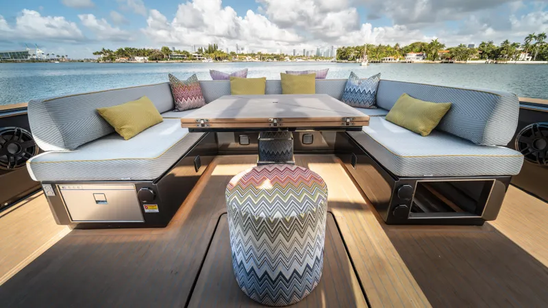 Slide: The Image of Luxurious 2023 Pardo Yachts P50 deck with elegant seating and scenic waterfront view. - 20