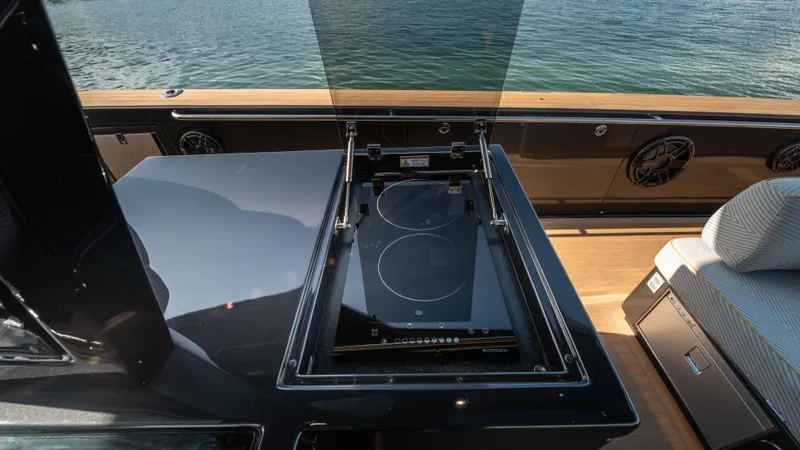 Slide: The Image of 2023 Pardo Yachts P50 featuring a sleek outdoor induction cooktop on deck. - 22