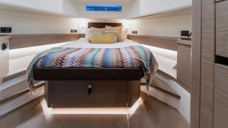 Slide: The Image of Luxurious cabin interior of 2023 Pardo Yachts P50 with stylish bedding and ambient lighting. - 31