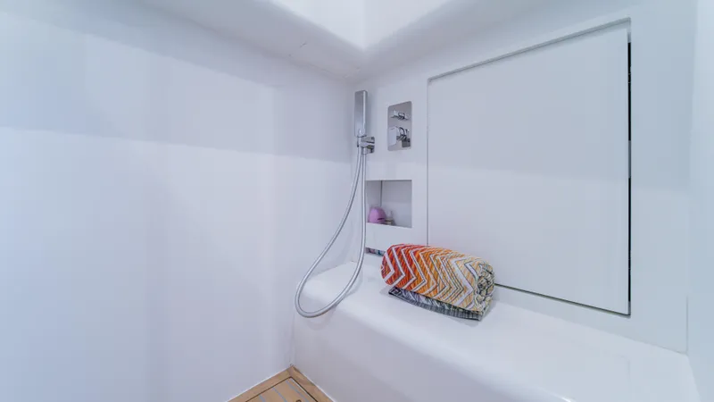 Slide: The Image of Modern shower area in 2023 Pardo Yachts P50, featuring sleek design and colorful towel. - 39