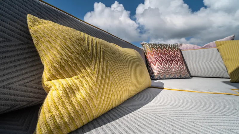 Slide: The Image of Luxurious seating with colorful cushions on 2023 Pardo Yachts P50 under a blue sky. - 42