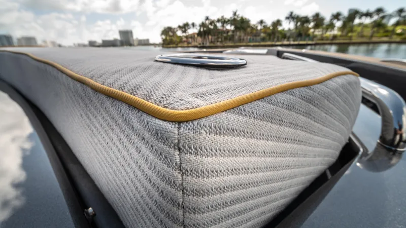 Slide: The Image of 2023 Pardo Yachts P50 close-up of cushioned deck detail with scenic background. - 45