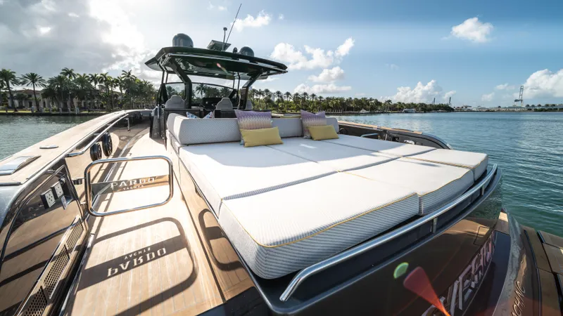 Slide: The Image of 2023 Pardo Yachts P50 luxury yacht with sunbathing deck, docked by palm trees. - 17