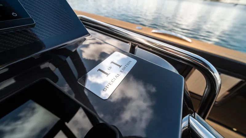 Slide: The Image of 2023 Pardo Yachts P50 Special Edition plaque reflecting sky and water. - 28