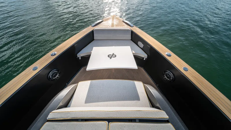 Slide: The Image of 2023 Pardo Yachts P50 bow with luxurious seating and elegant design on calm water. - 29