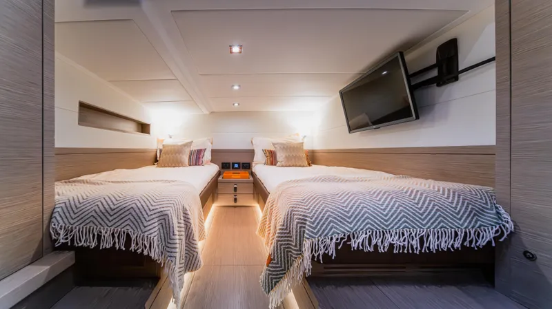 Slide: The Image of Luxurious 2023 Pardo Yachts P50 cabin with twin beds and modern decor. - 37