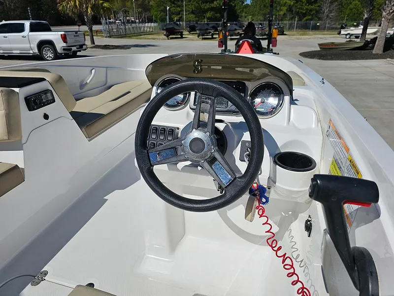 Slide: The Image of 2020 Hurricane SunDeck Sport 185 OB boat interior with steering wheel and dashboard controls. - 13
