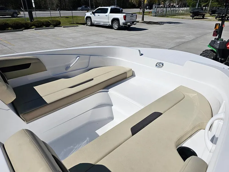 Slide: The Image of 2020 Hurricane SunDeck Sport 185 OB boat interior with beige seating, parked outdoors. - 14
