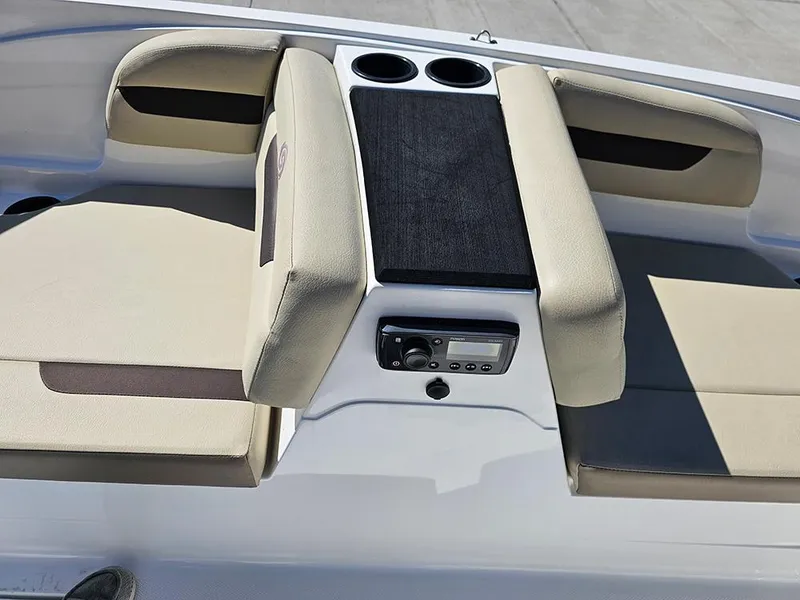 Slide: The Image of 2020 Hurricane SunDeck Sport 185 OB interior with beige seating and cup holders. - 19