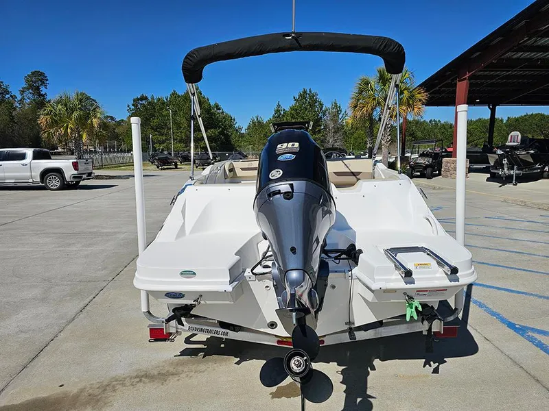 Slide: The Image of 2020 Hurricane SunDeck Sport 185 OB boat with outboard motor in a parking lot. - 7