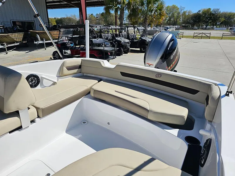 Slide: The Image of 2020 Hurricane SunDeck Sport 185 OB boat interior with beige seating and outboard motor. - 9