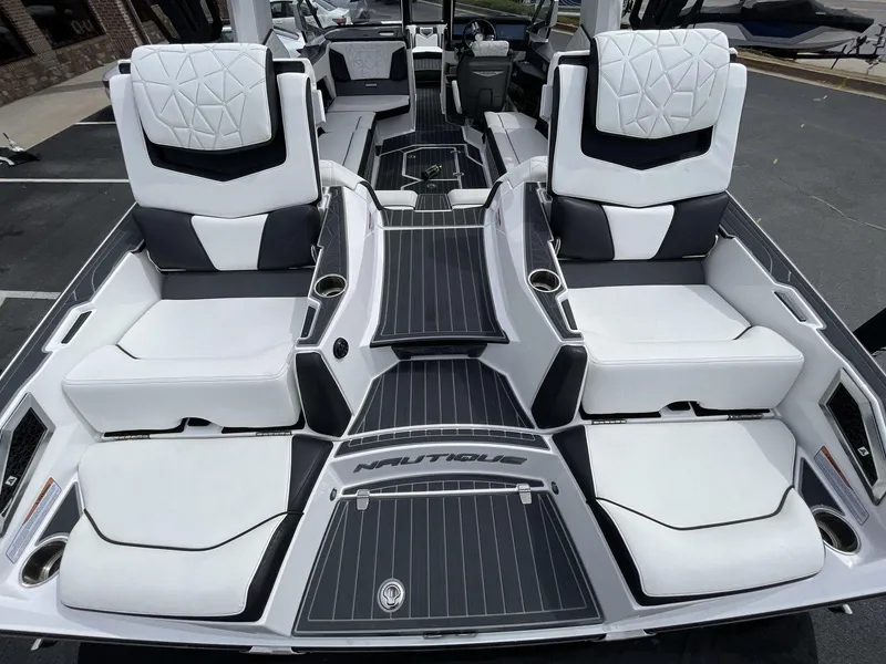 Slide: The Image of 2023 Nautique Super Air Nautique G25 Paragon interior with luxurious seating and sleek design. - 13