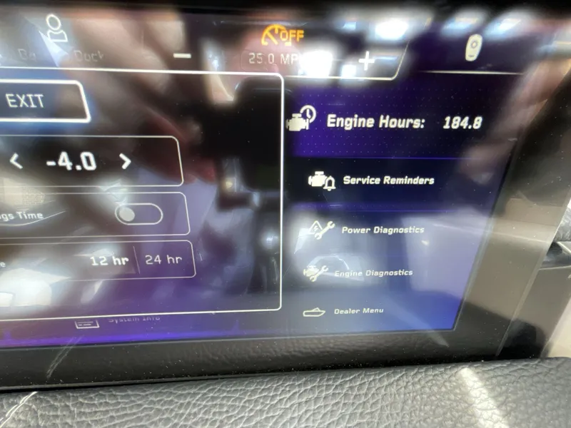 Slide: The Image of 2023 Nautique Super Air Nautique G25 Paragon dashboard displaying engine hours and diagnostics. - 15