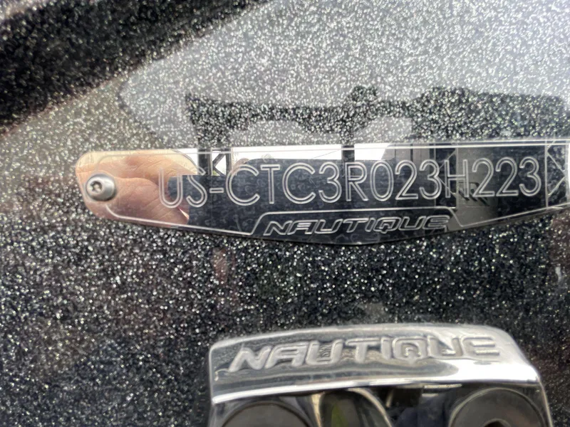 Slide: The Image of 2023 Nautique Super Air Nautique G25 Paragon hull identification number plate. - 2