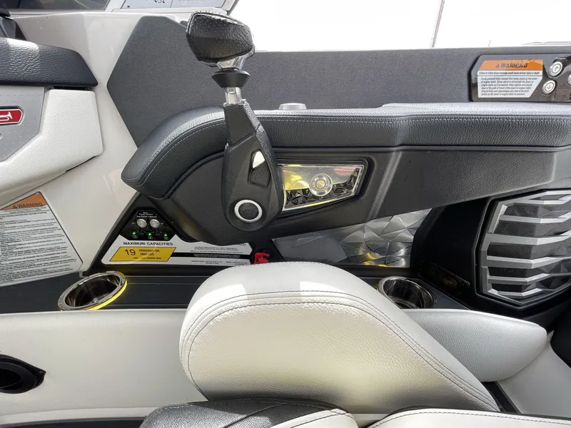 Slide: The Image of 2023 Nautique Super Air Nautique G25 Paragon interior with control panel and seating. - 27