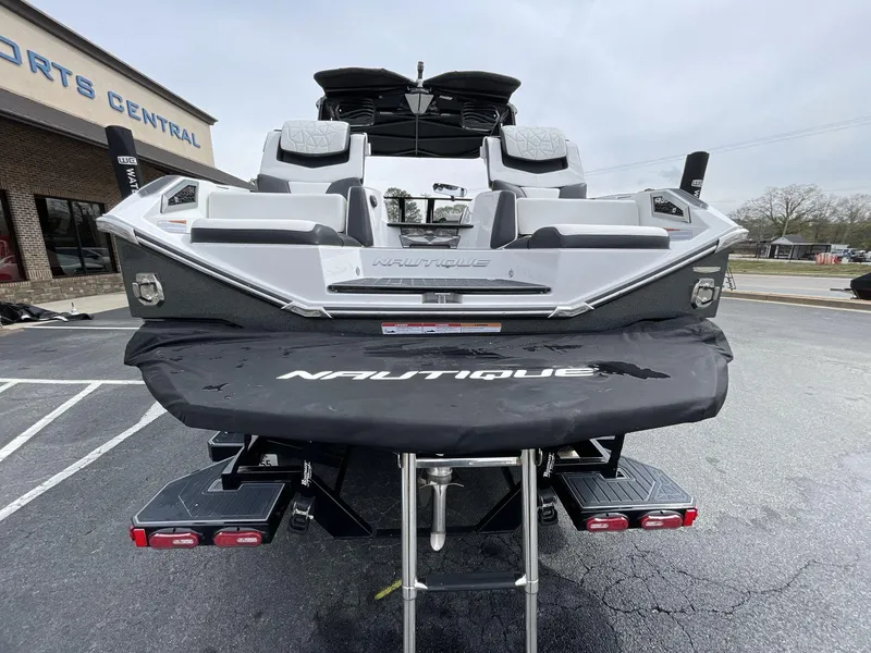 Slide: The Image of 2023 Nautique Super Air Nautique G25 Paragon boat rear view in parking lot. - 6