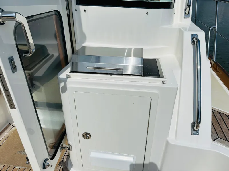 Slide: The Image of Outdoor grill on 2014 Grand Banks 46 Eastbay SX yacht deck. - 14