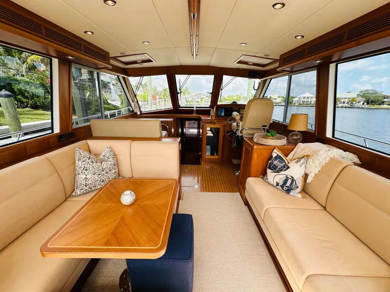 Slide: The Image of Luxurious interior of 2014 Grand Banks 46 Eastbay SX yacht with elegant seating and wooden accents. - 15