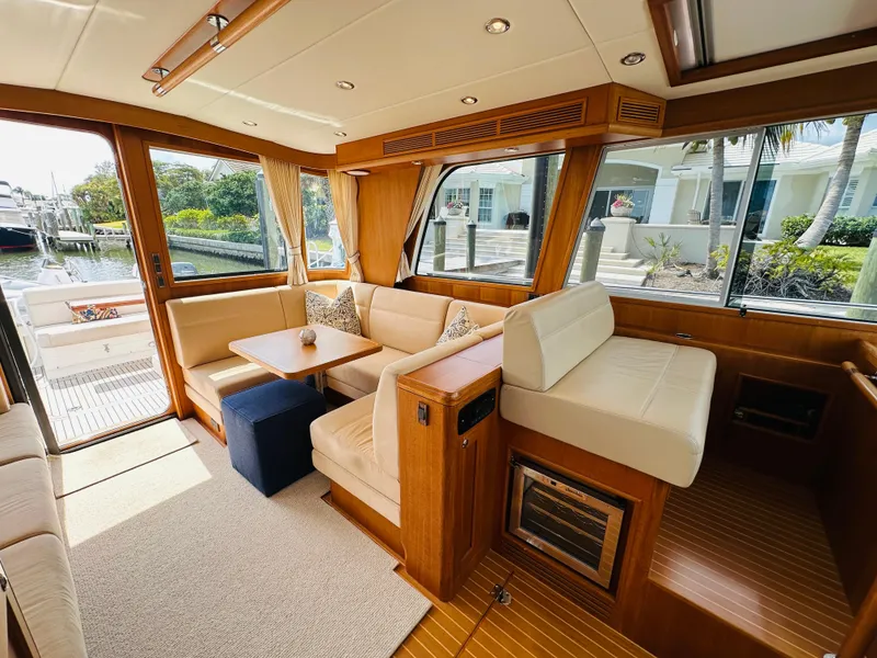 Slide: The Image of Luxurious interior of 2014 Grand Banks 46 Eastbay SX yacht with elegant seating and wood finishes. - 18