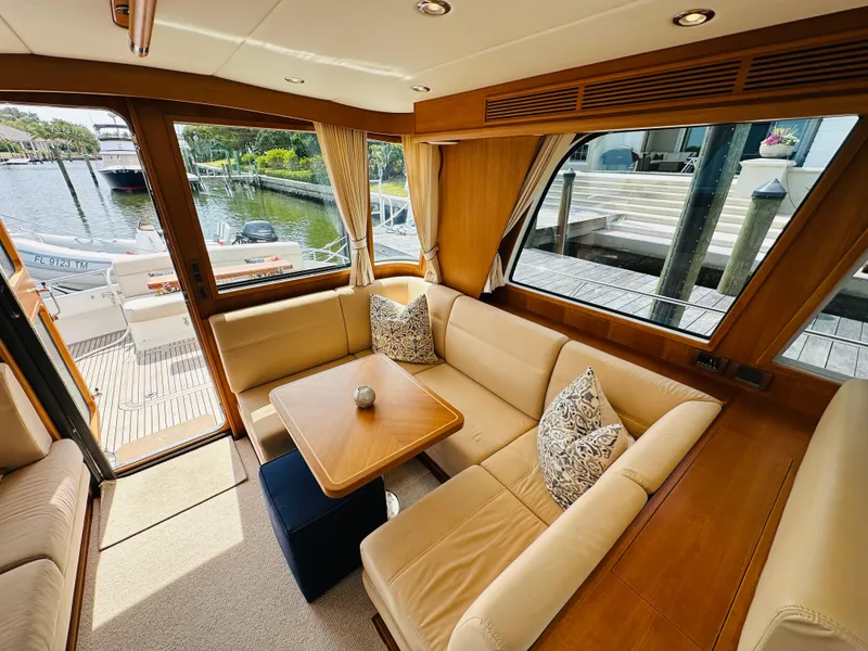 Slide: The Image of Luxurious interior of 2014 Grand Banks 46 Eastbay SX yacht with elegant seating and table. - 19