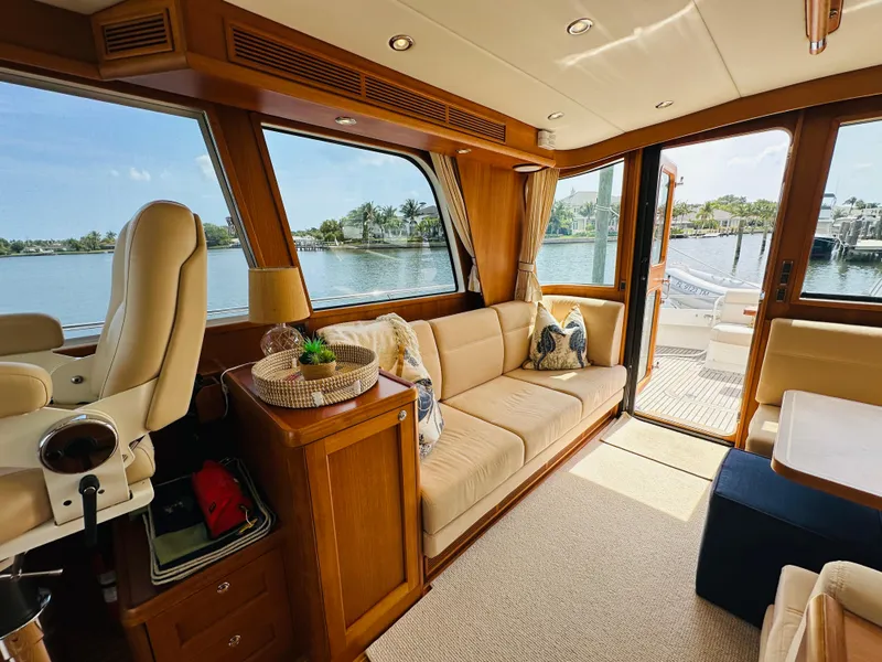 Slide: The Image of Luxurious interior of 2014 Grand Banks 46 Eastbay SX yacht with waterfront view. - 21