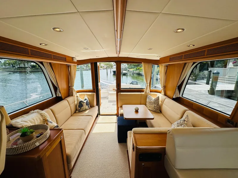 Slide: The Image of Luxurious interior of 2014 Grand Banks 46 Eastbay SX yacht with elegant seating and wood finishes. - 22