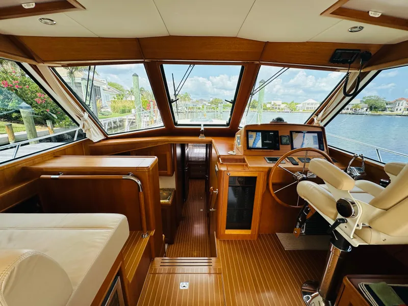 Slide: The Image of 2014 Grand Banks 46 Eastbay SX yacht interior with wooden finish and navigation equipment. - 25