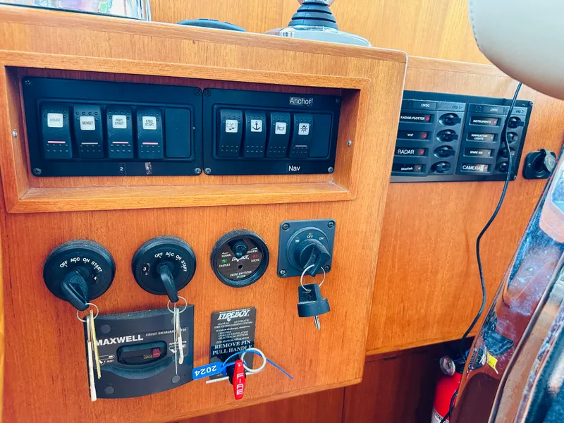 Slide: The Image of Control panel of 2014 Grand Banks 46 Eastbay SX yacht with switches and keys. - 29