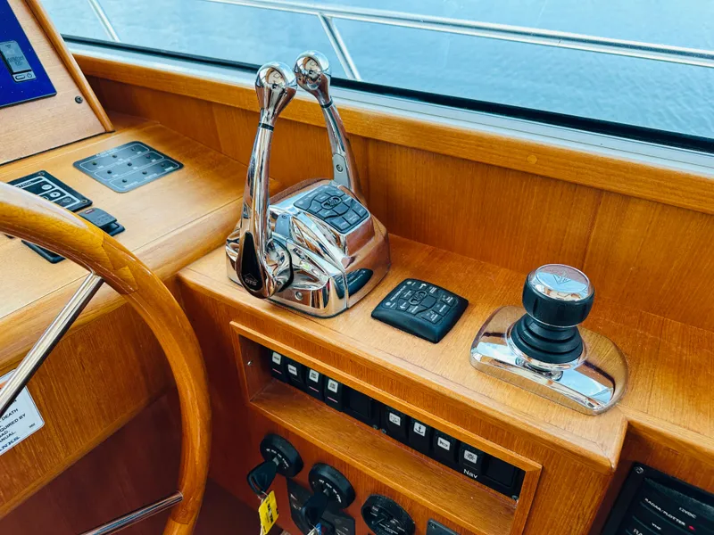 Slide: The Image of Control panel of 2014 Grand Banks 46 Eastbay SX yacht with wooden finish and chrome details. - 30