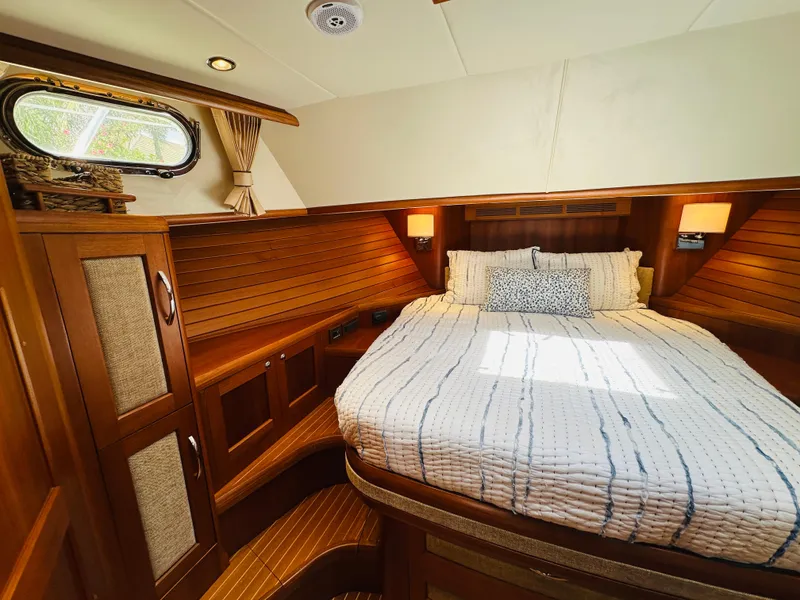 Slide: The Image of Luxurious cabin interior of 2014 Grand Banks 46 Eastbay SX yacht with cozy bed. - 42
