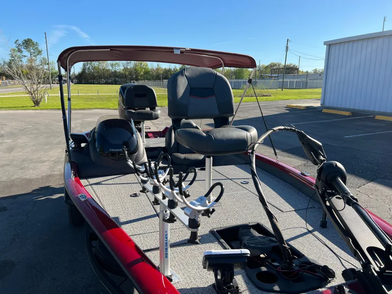 Slide: The Image of 2022 Bass Tracker Pro Team 175 boat with fishing seats and equipment on deck. - 13