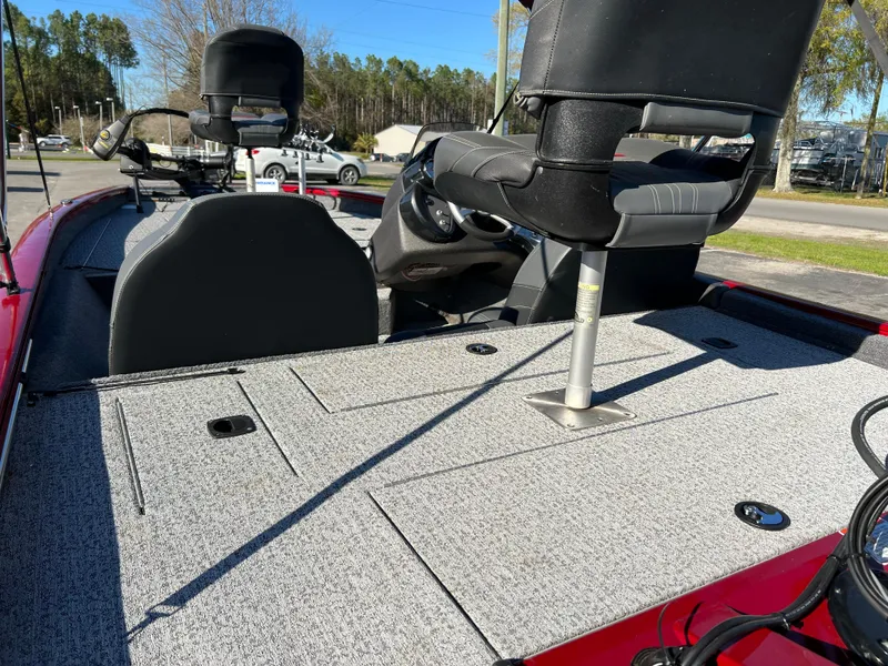 Slide: The Image of 2022 Bass Tracker Pro Team 175 boat interior with seating and storage compartments. - 19