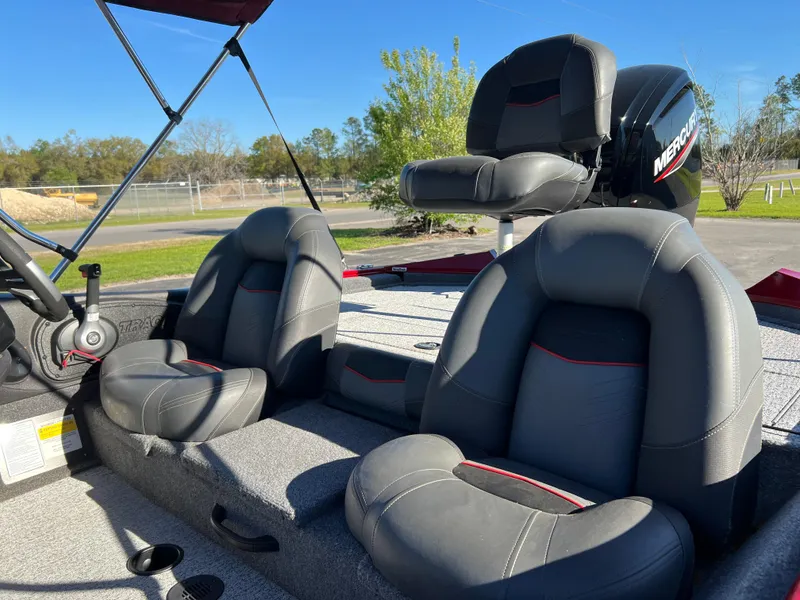 Slide: The Image of 2022 Bass Tracker Pro Team 175 boat interior with gray seating and Mercury engine. - 20