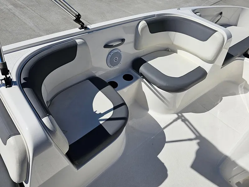 Slide: The Image of 2021 Bayliner Element E18 boat interior with gray and white seating. - 14