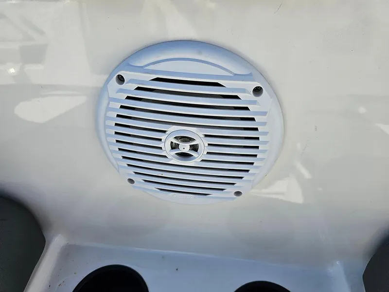 Slide: The Image of Boat speaker on 2021 Bayliner Element E18, white grille, mounted on interior panel. - 22