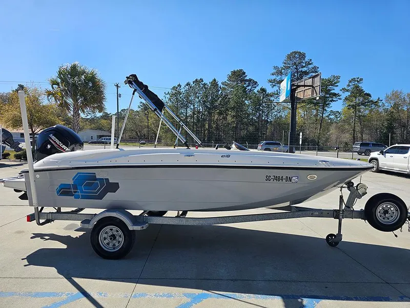 Slide: The Image of 2021 Bayliner Element E18 boat on trailer, parked outdoors. - 5