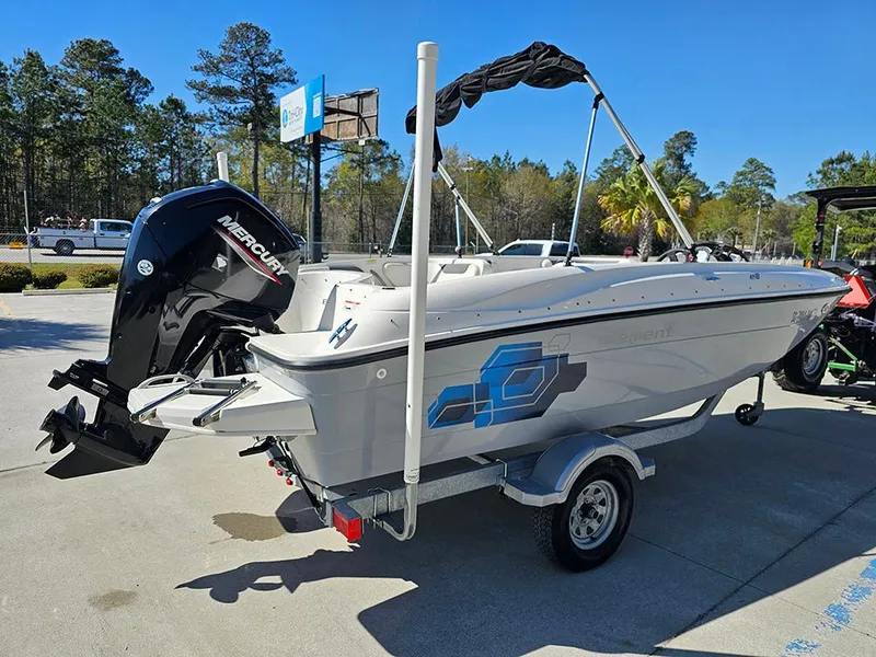 Slide: The Image of 2021 Bayliner Element E18 boat with Mercury engine on trailer, parked outdoors. - 6