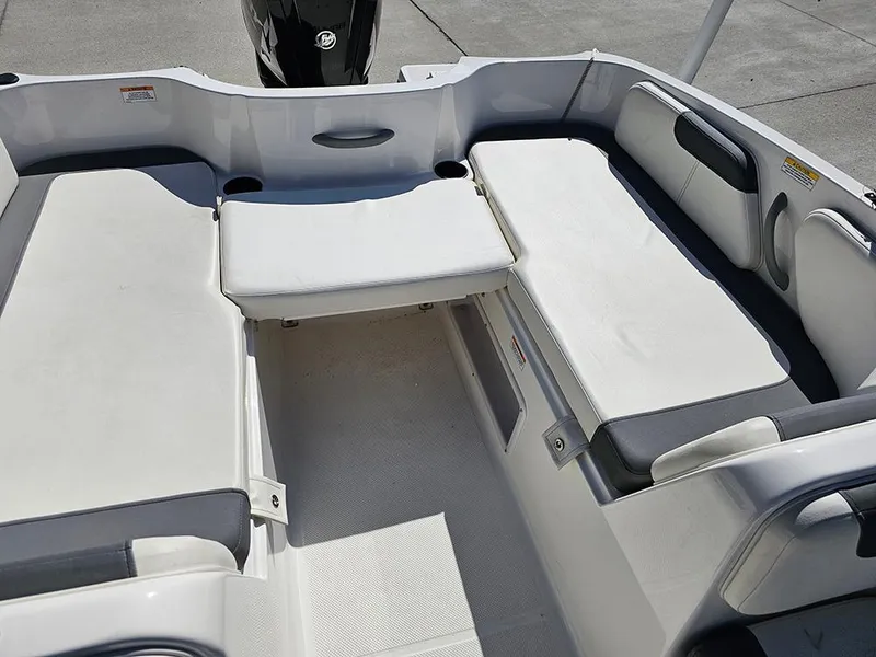 Slide: The Image of 2021 Bayliner Element E18 boat interior with spacious seating and modern design. - 9
