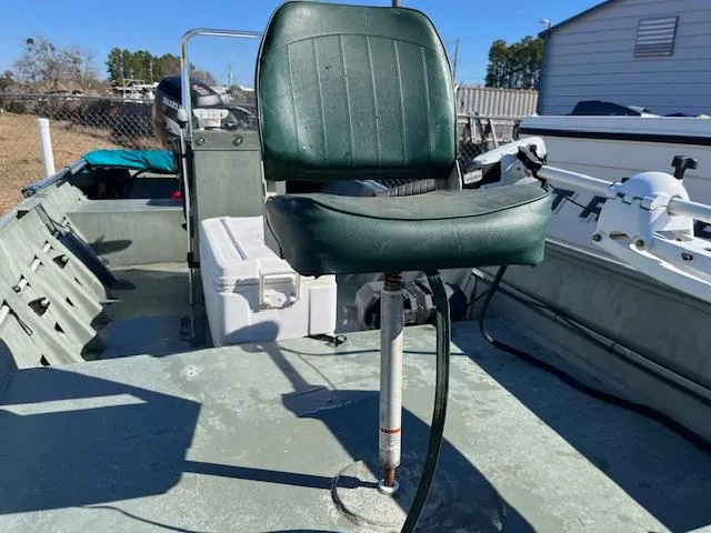 Slide: The Image of 2011 Southfork 16CC boat with green swivel seat and fishing equipment. - 10