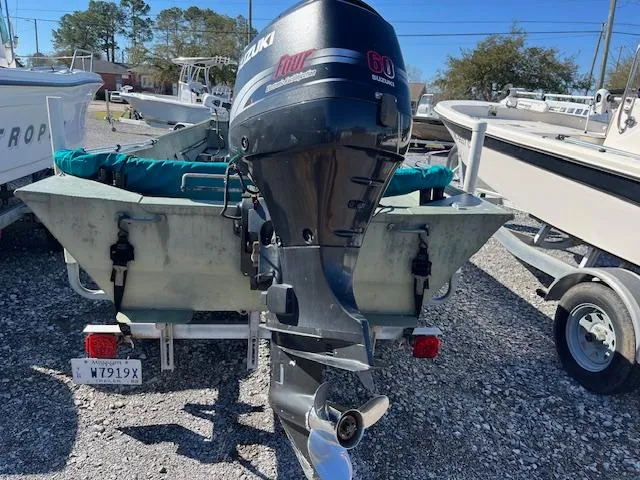 Slide: The Image of 2011 Southfork 16CC boat with Suzuki 60 horsepower outboard motor on trailer. - 4