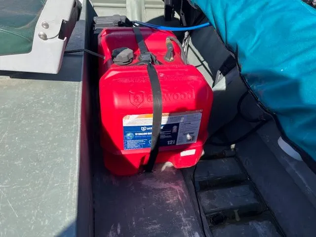 Slide: The Image of Red fuel tank secured in a 2011 Southfork 16CC boat. - 5