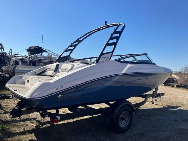 Slide: The Image of 2024 Yamaha Boats 195S on trailer, sleek design, blue and white color scheme. - 3
